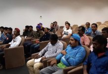 Community Service student volunteers teach workers English